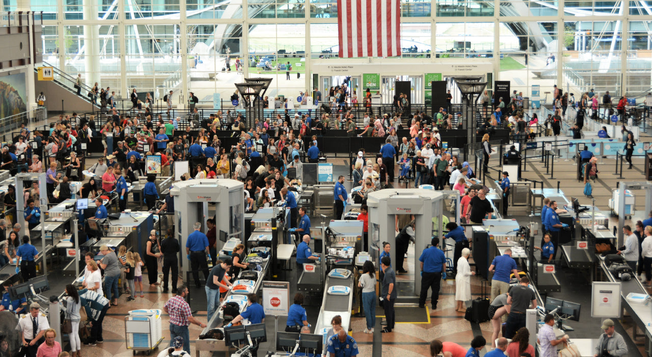 Putting Shoes on at Airport